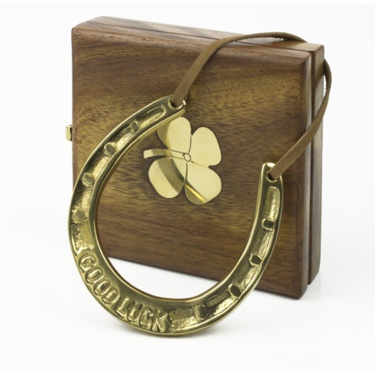 Brass horseshoe in wooden box